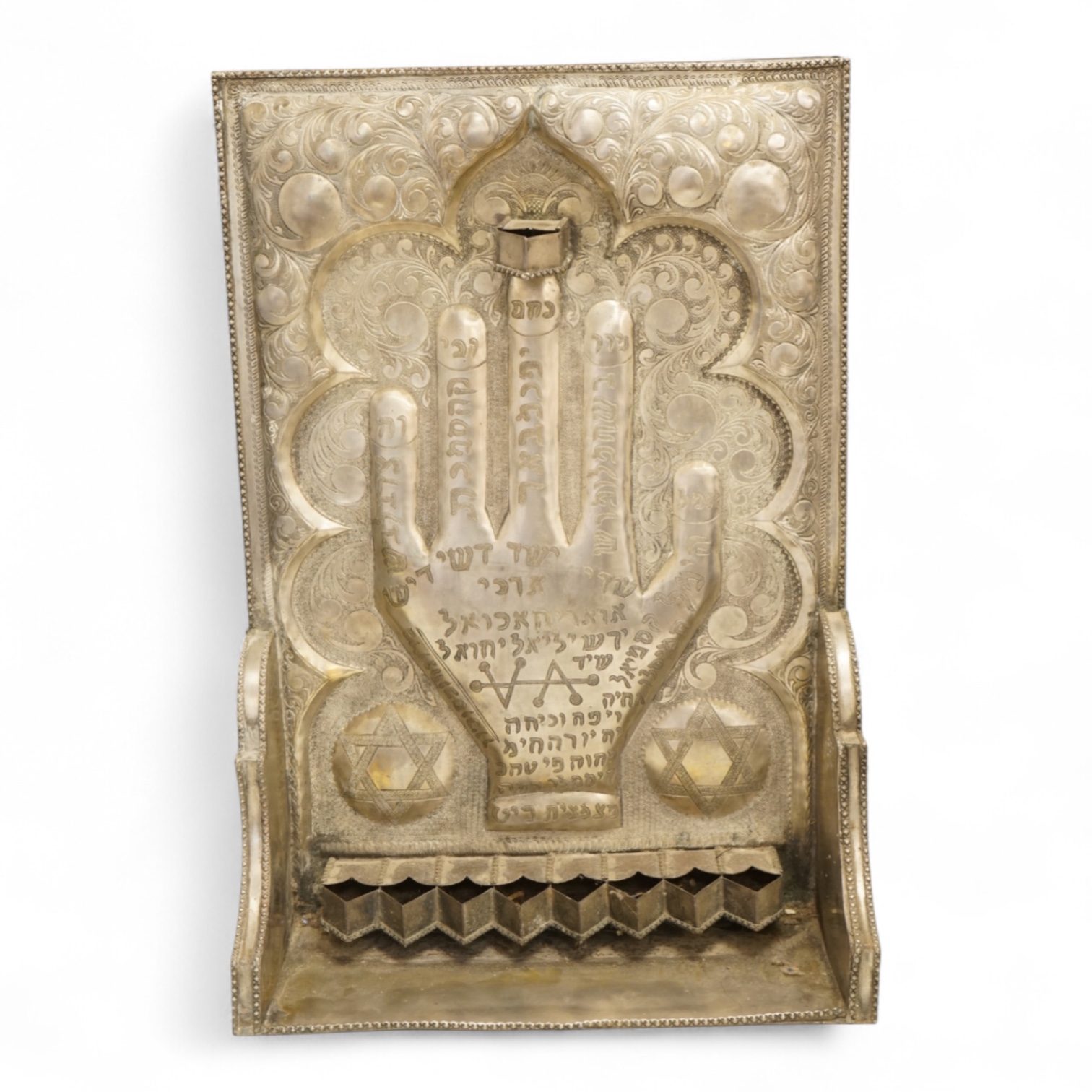 A Jewish embossed white metal menorah, 51cm high